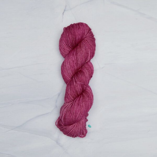Semisolid Spinach Leaf Superwash Merino yarn.